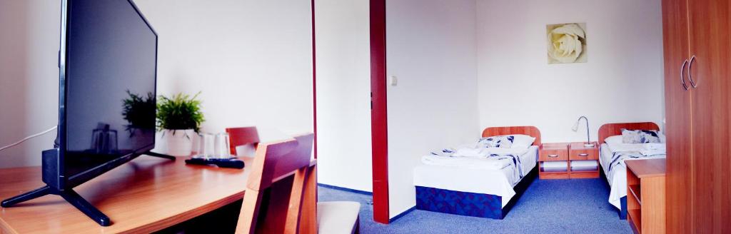 Voodi või voodid majutusasutuse Hotel S-centrum toas