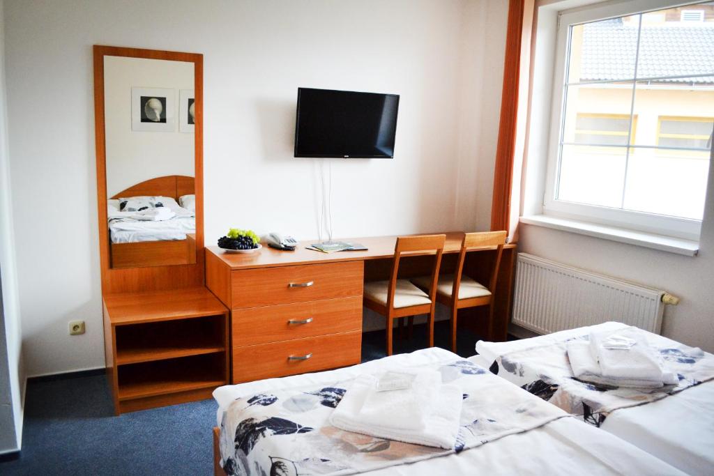 Voodi või voodid majutusasutuse Hotel S-centrum toas