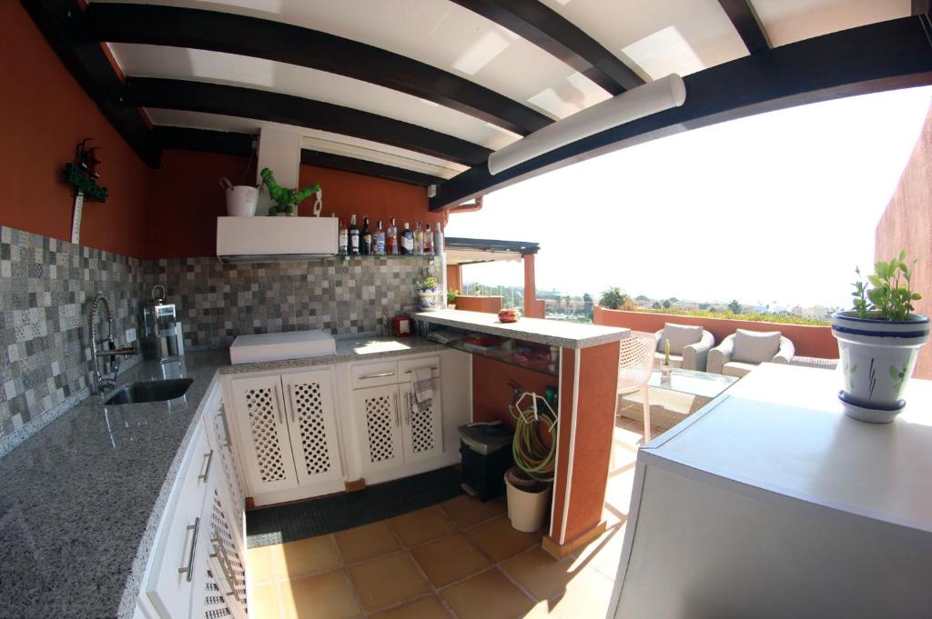 Kuchyňa alebo kuchynka v ubytovaní Penthouse Patio de doña Julia