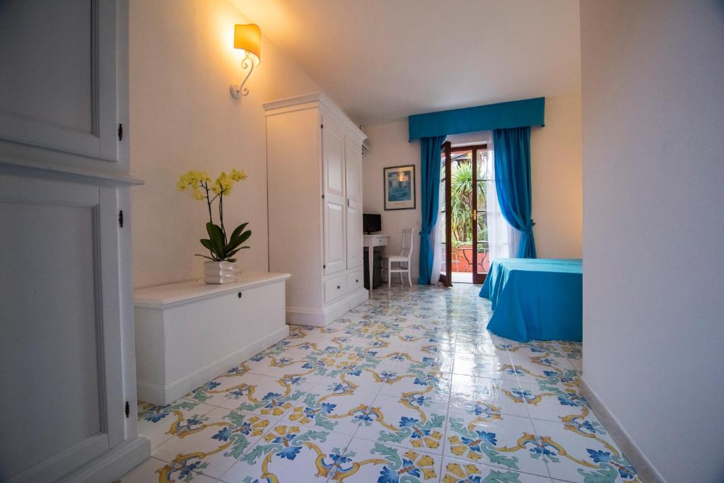 Postel nebo postele na pokoji v ubytování Hotel Residence Villa San Giovanni