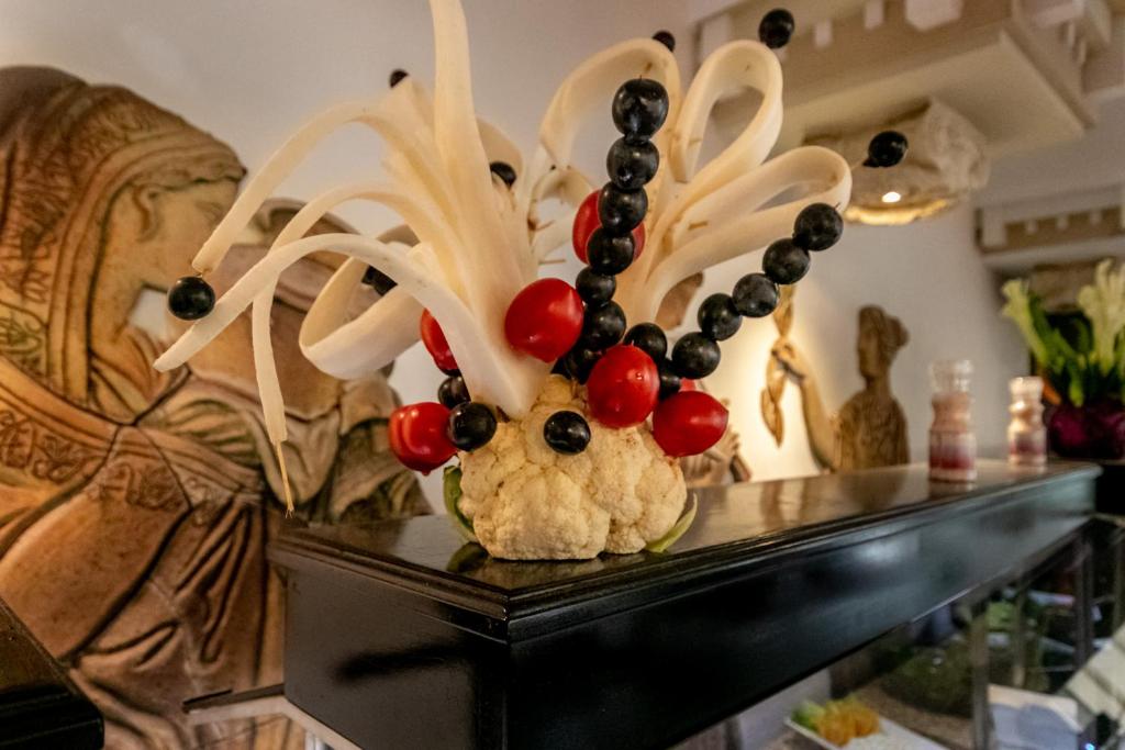 a vase with decorations on top of a table at Lara Park Hotel in Antalya