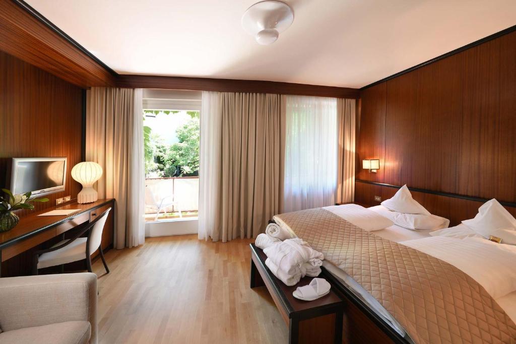 Postel nebo postele na pokoji v ubytování Hotel Juliane
