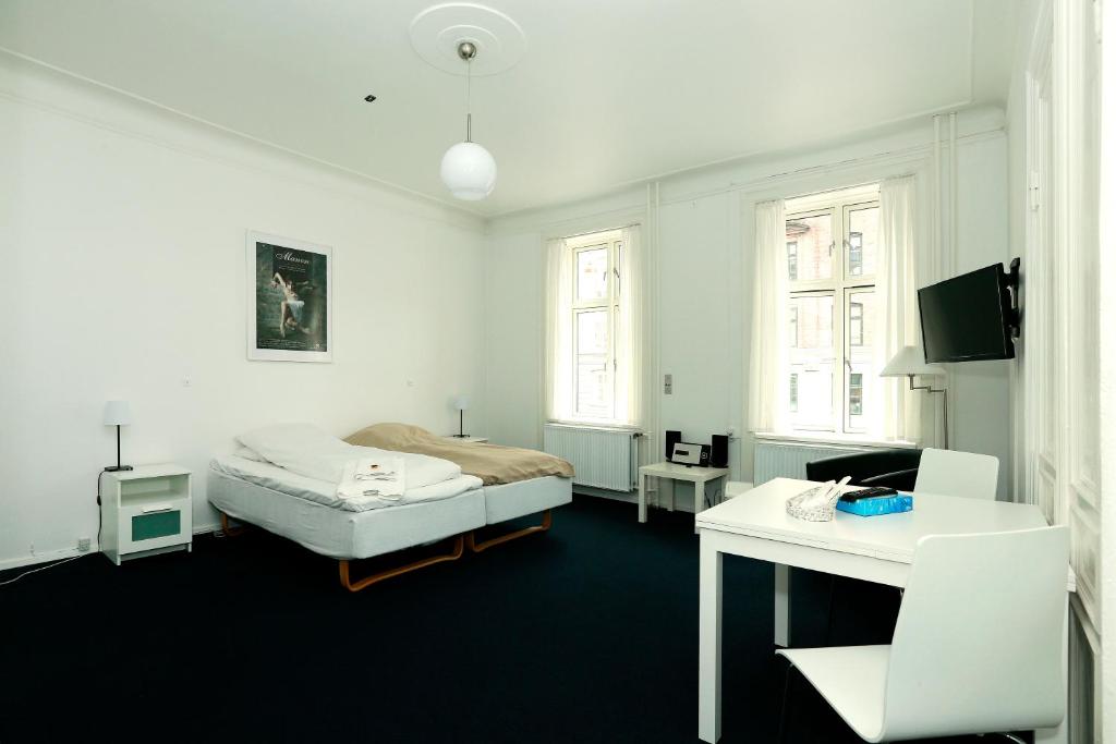 Postel nebo postele na pokoji v ubytování Hotel 9 små hjem