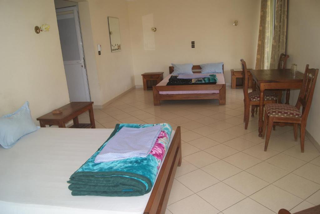 Postel nebo postele na pokoji v ubytování HOTEL MENABE