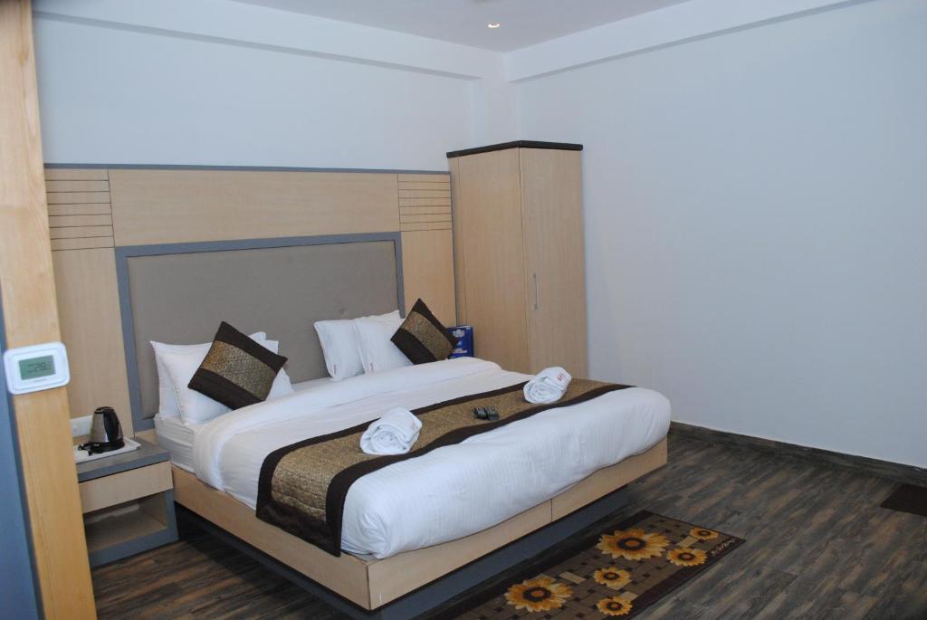 Postel nebo postele na pokoji v ubytování Hotel Superb 5 Mins Walk From New Delhi Station