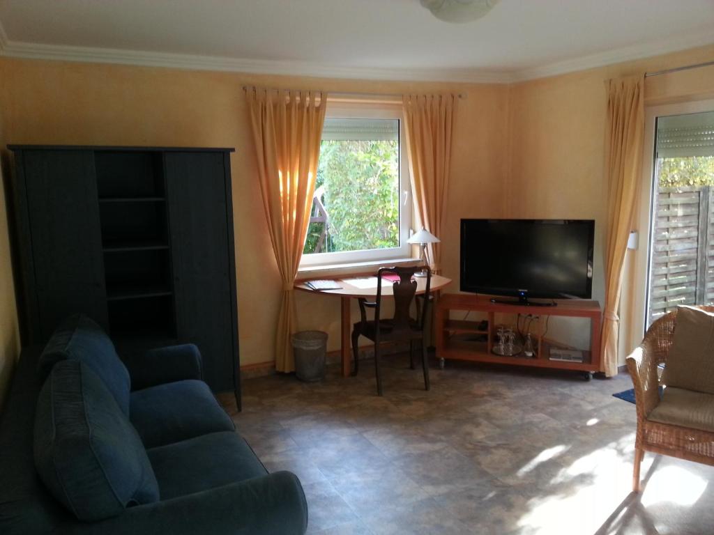 TV a/nebo společenská místnost v ubytování Hotel Alte Straßenmeisterei
