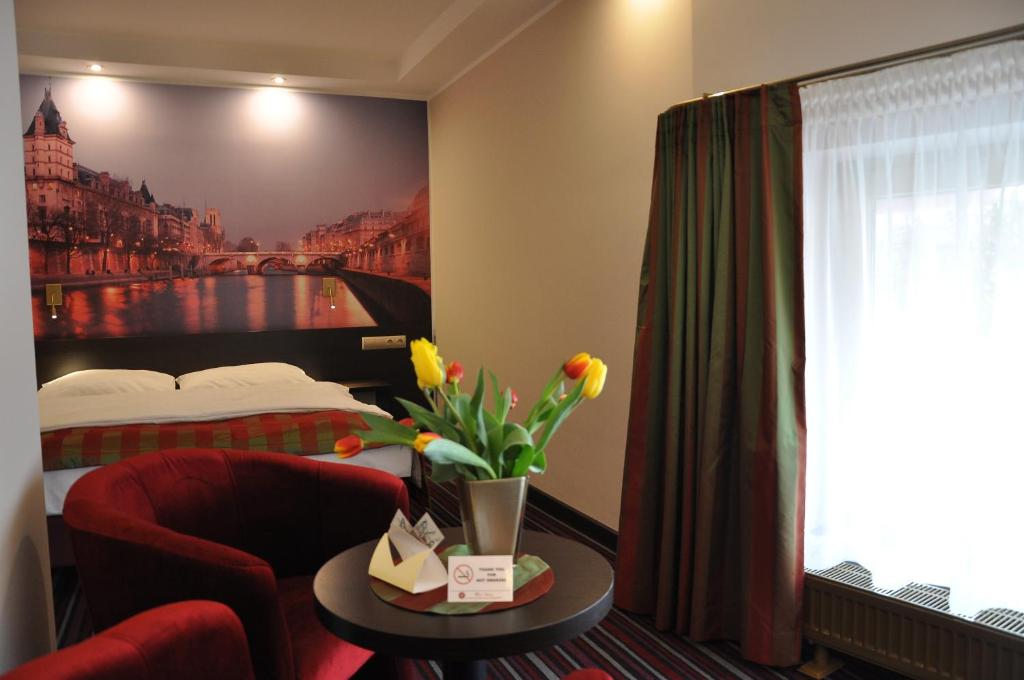 Postel nebo postele na pokoji v ubytování Hotel Atrium