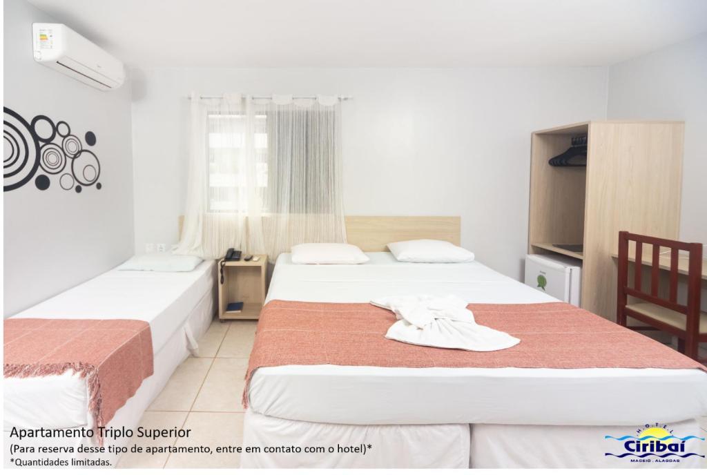 Postel nebo postele na pokoji v ubytování Hotel Ciribaí