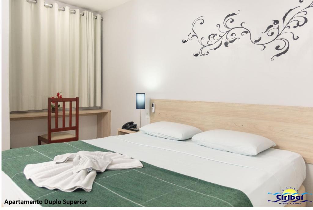 Postel nebo postele na pokoji v ubytování Hotel Ciribaí