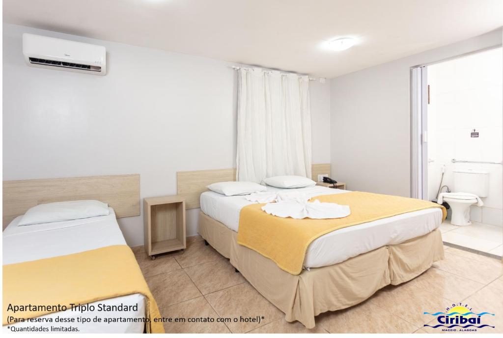 Postel nebo postele na pokoji v ubytování Hotel Ciribaí