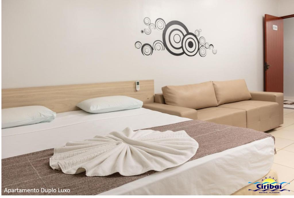 Postel nebo postele na pokoji v ubytování Hotel Ciribaí