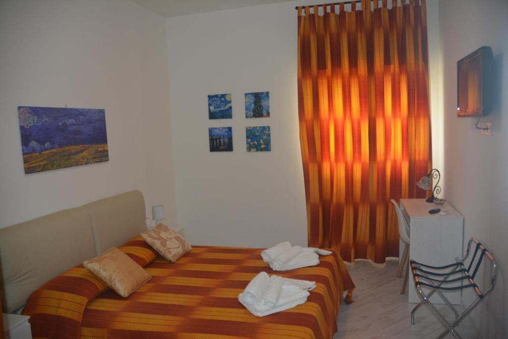 A bed or beds in a room at ART B&B