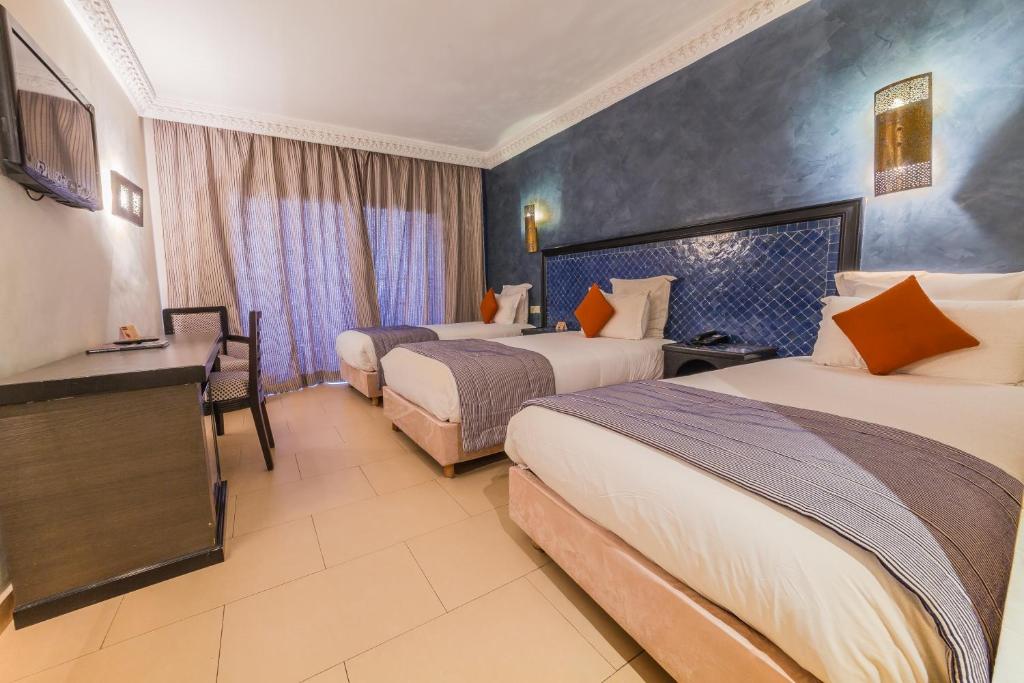 Postel nebo postele na pokoji v ubytování Zalagh Kasbah Hotel & Spa