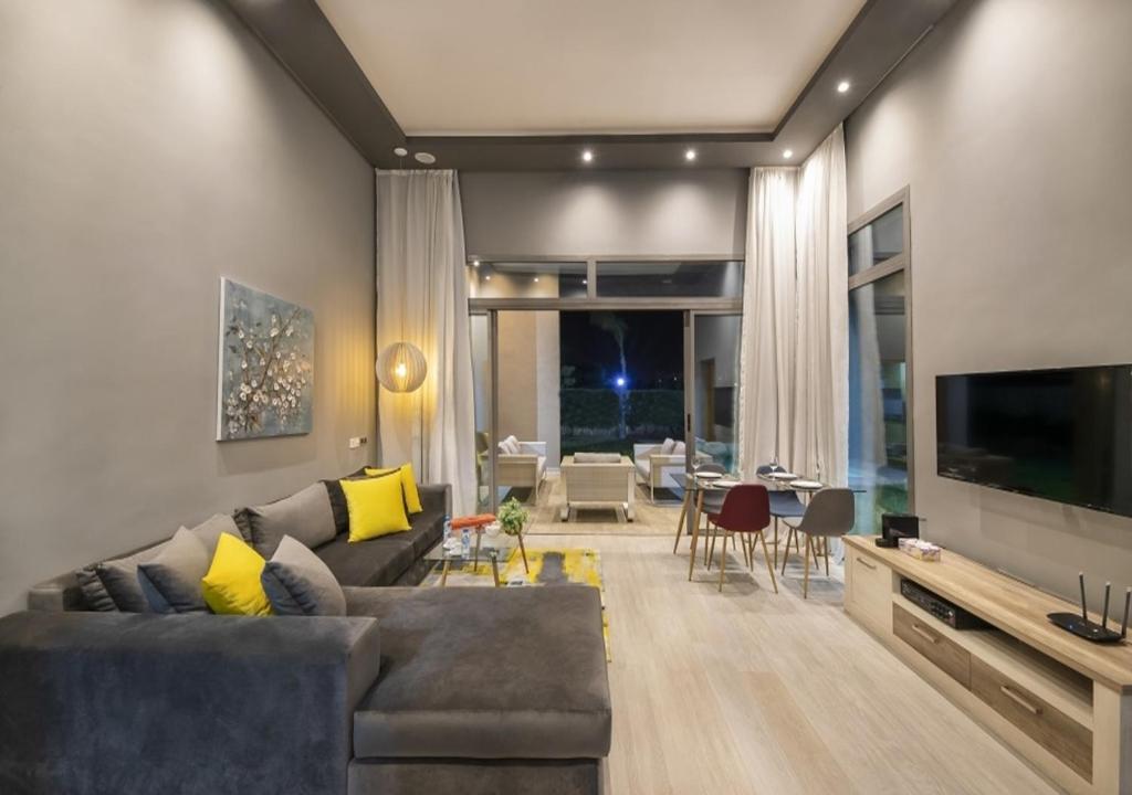 Posezení v ubytování Palms Edge Villas avec Piscine & Jardin Privés