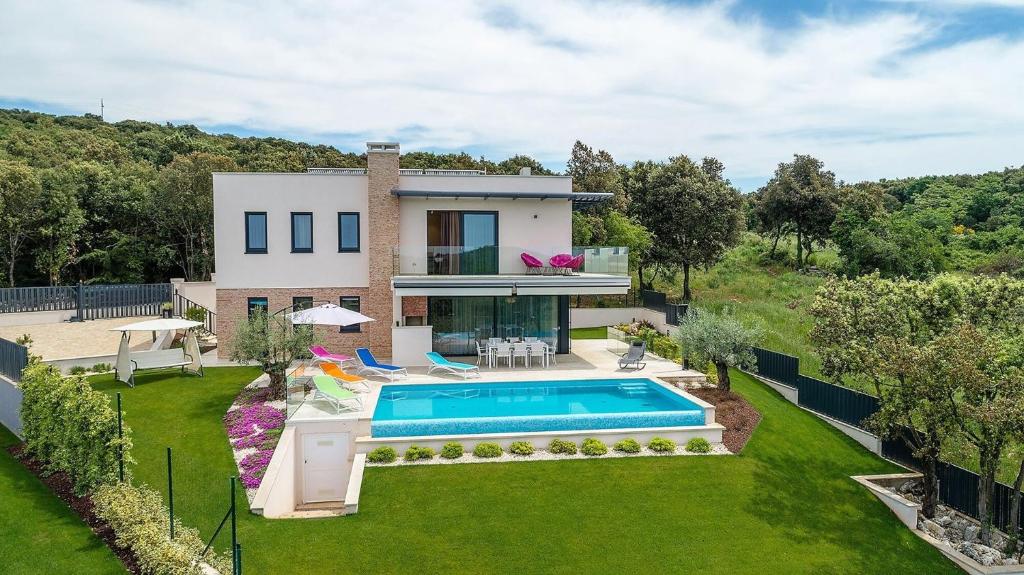 an aerial view of a house with a swimming pool at Villa Maja in Vrsar