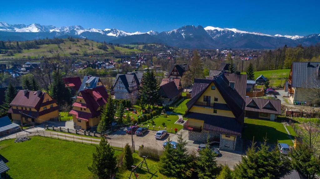 an aerial view of a small town with snow covered mountains at Willa u Zwijacza in Zakopane