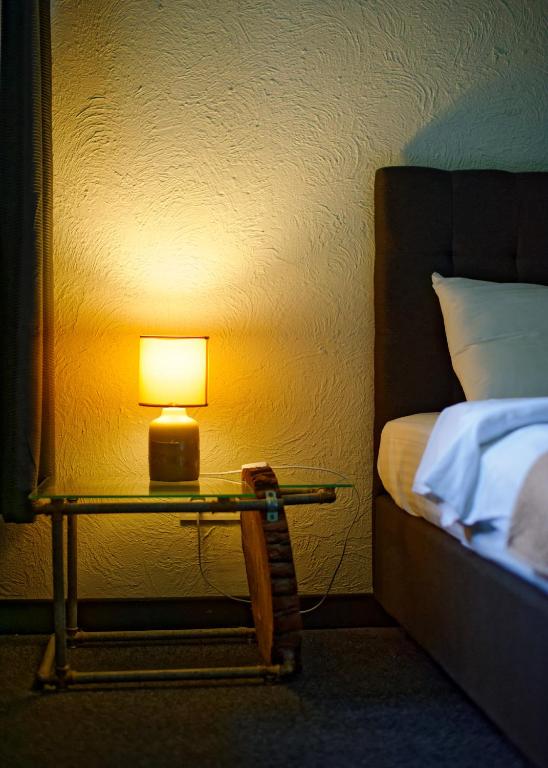 Postel nebo postele na pokoji v ubytování Hotel Buninn