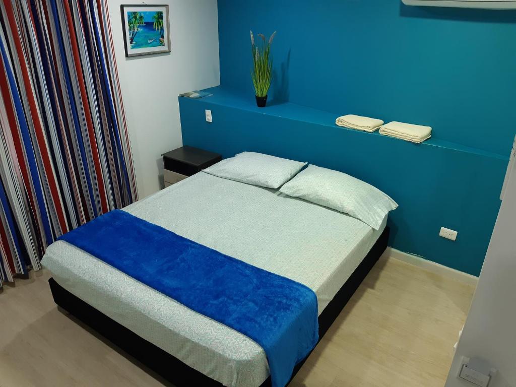 Postel nebo postele na pokoji v ubytování Palmare House