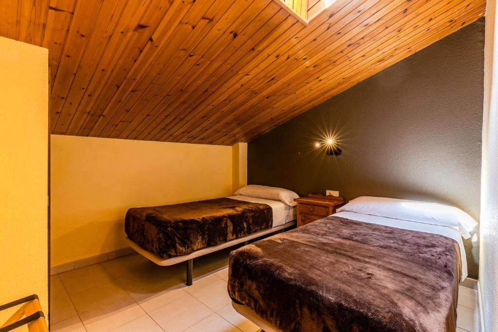 Postel nebo postele na pokoji v ubytování Apartamentos Turisticos Poblado