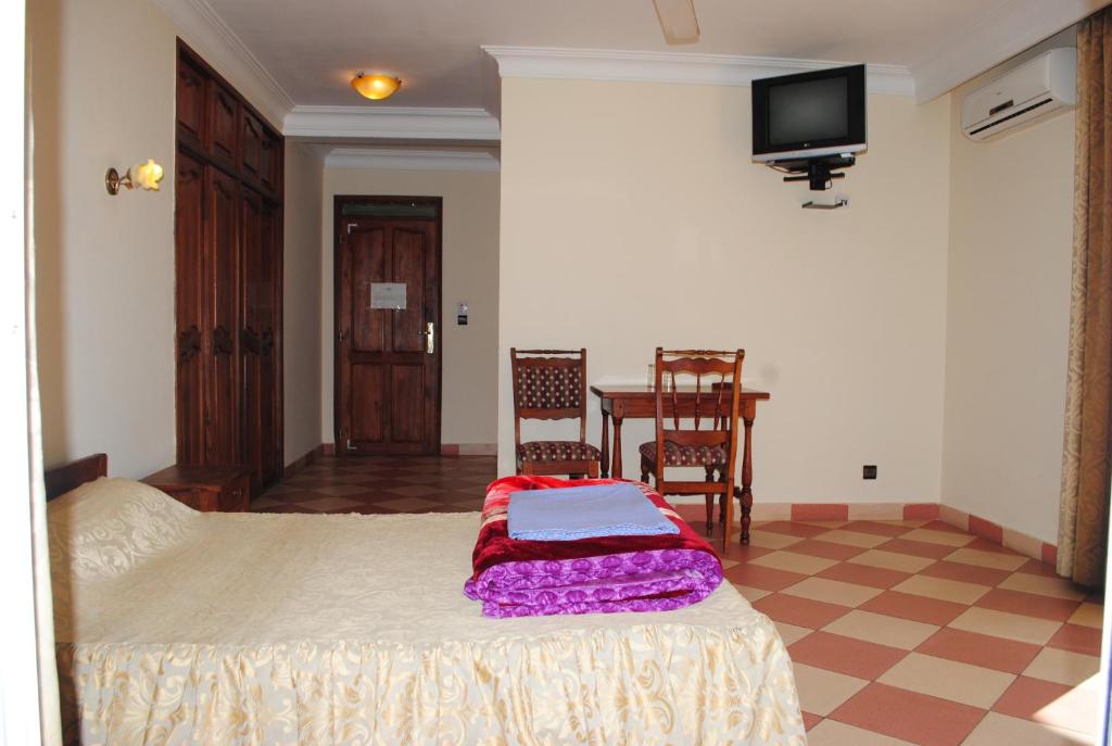 Postel nebo postele na pokoji v ubytování HOTEL MENABE