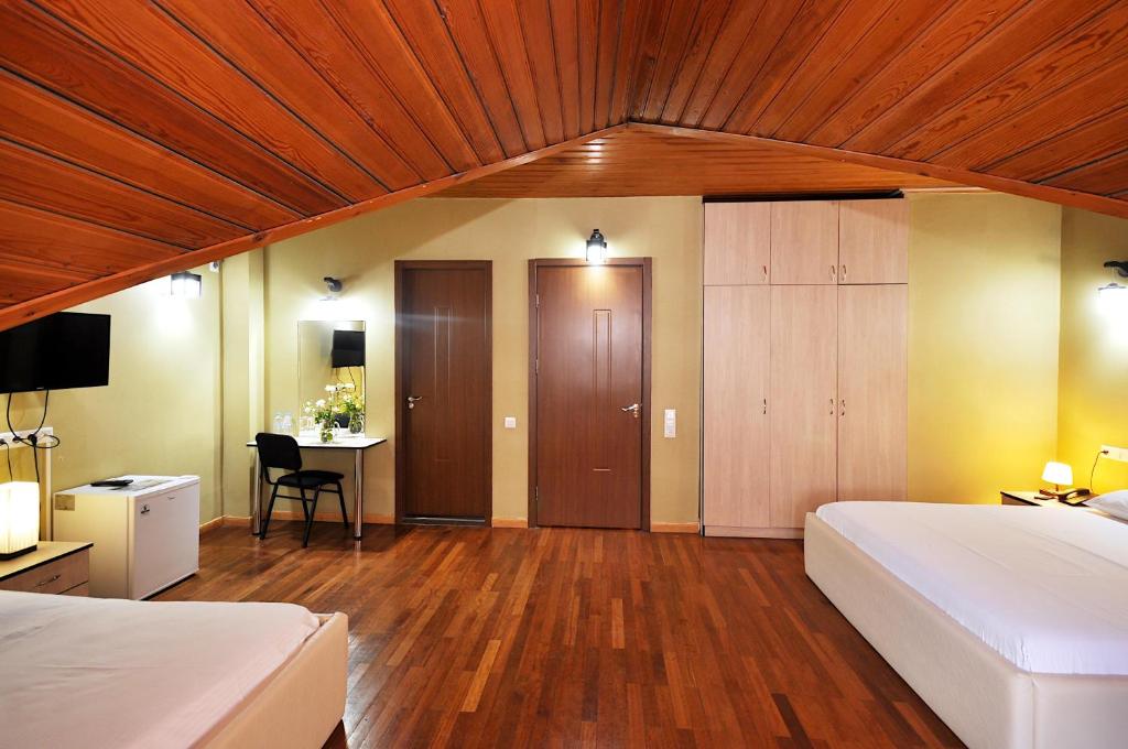 Postel nebo postele na pokoji v ubytování Hotel Frida
