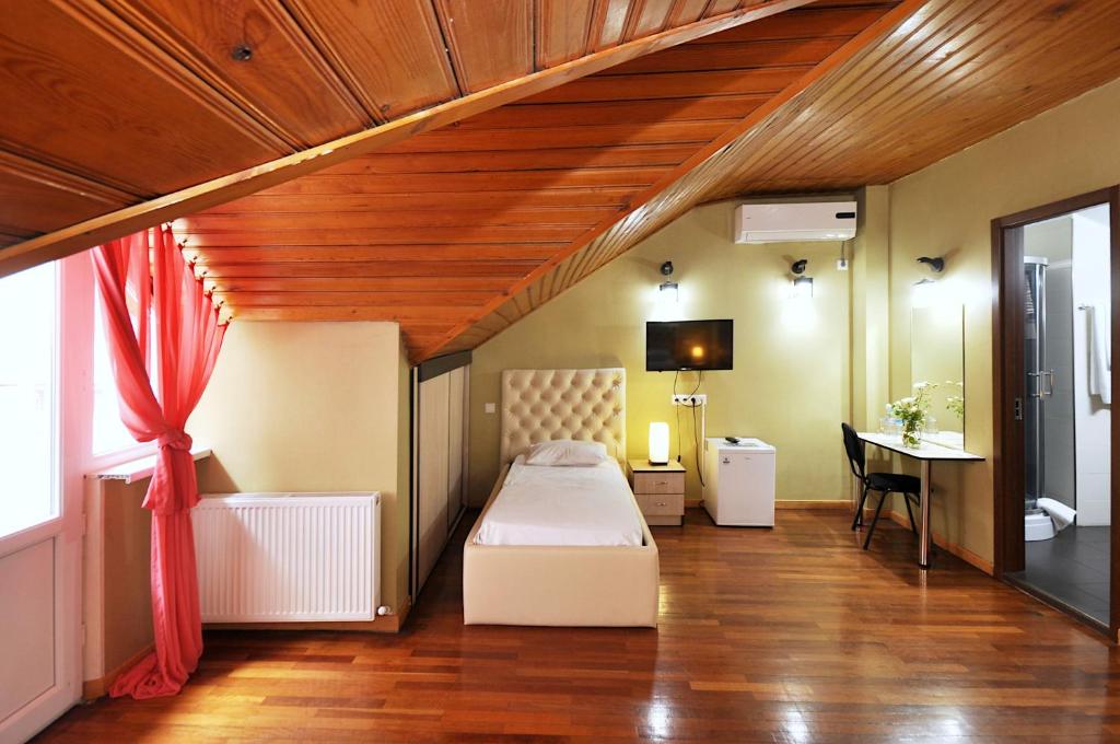Postel nebo postele na pokoji v ubytování Hotel Frida