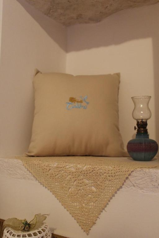 Łóżko lub łóżka w pokoju w obiekcie TRULLI COLIBRI'