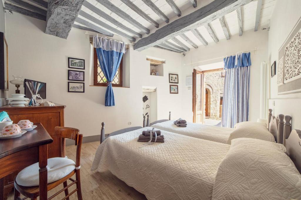 A bed or beds in a room at La Lanciotta