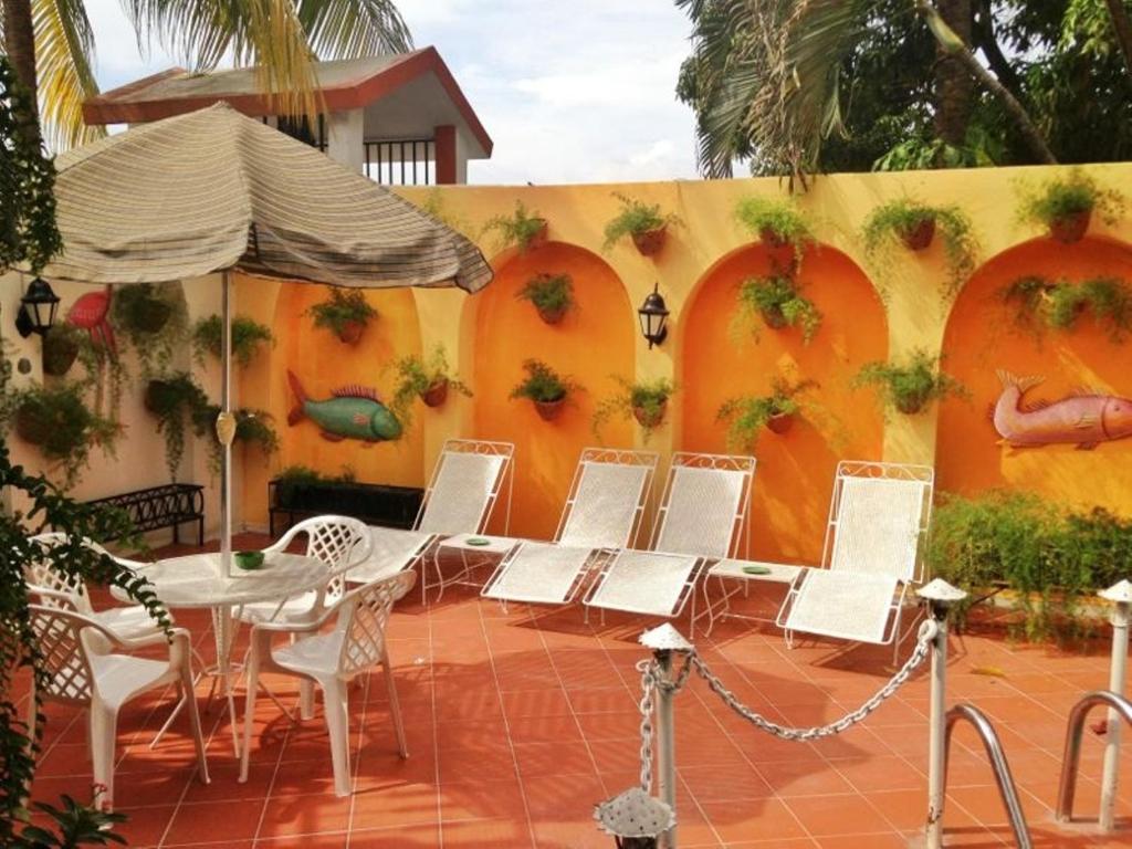 Patio nebo venkovní prostory v ubytování Ideal Villa Hotel