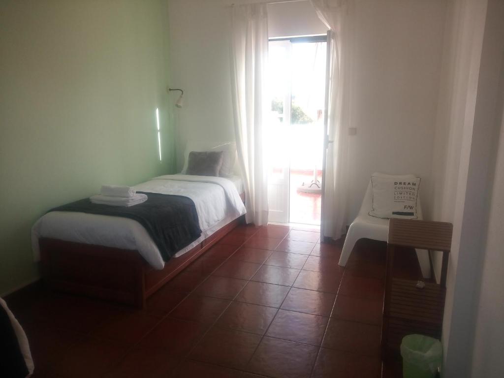 Postel nebo postele na pokoji v ubytování Ergobeach House