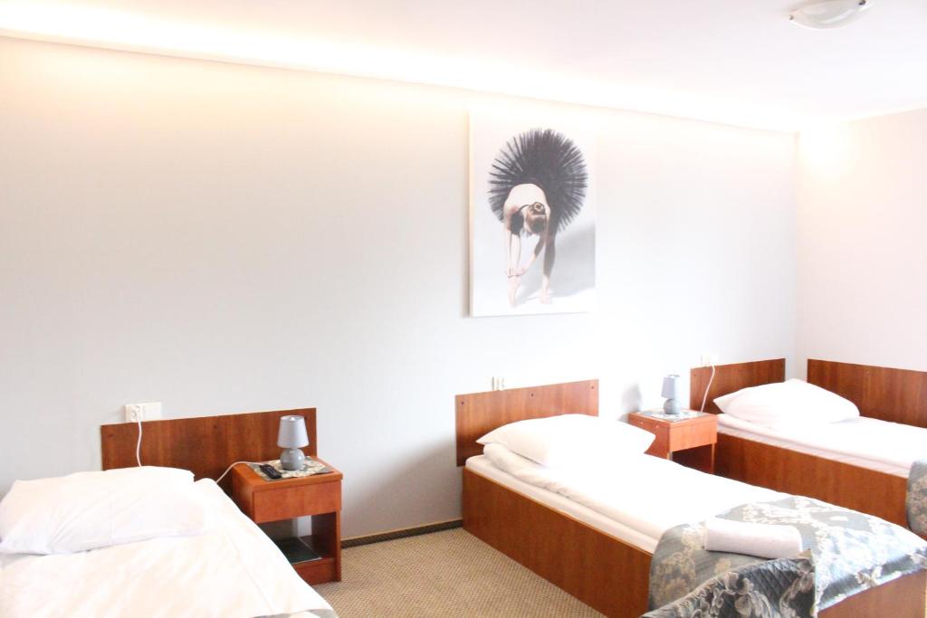 Posteľ alebo postele v izbe v ubytovaní Restauracja Hotel Kassandra