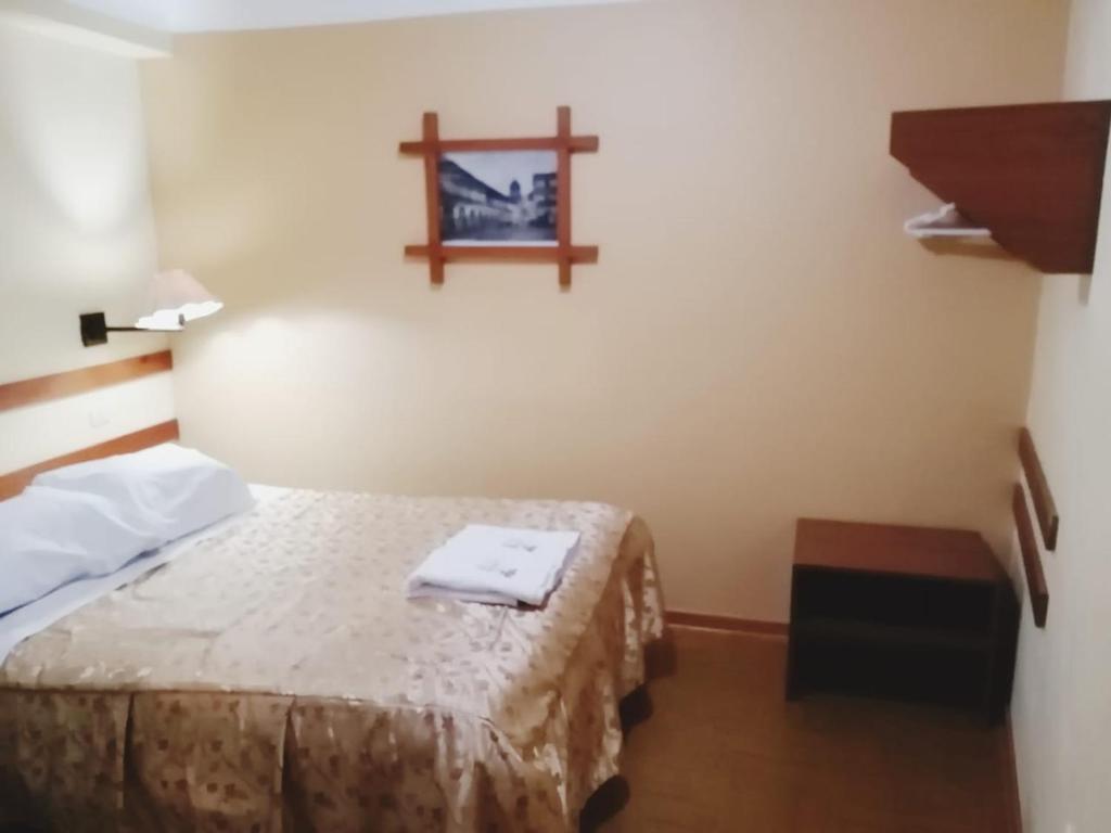 Postel nebo postele na pokoji v ubytování Conquista Cusco