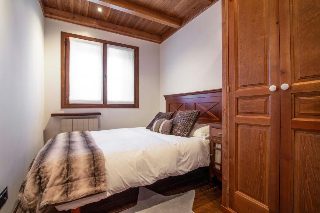 Postel nebo postele na pokoji v ubytování ADELAIDA de Alma de Nieve