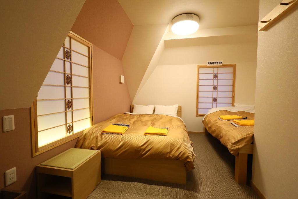 Postel nebo postele na pokoji v ubytování Wa Style Tokyo