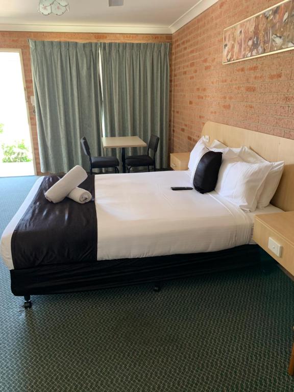 Postel nebo postele na pokoji v ubytování Branxton House Motel