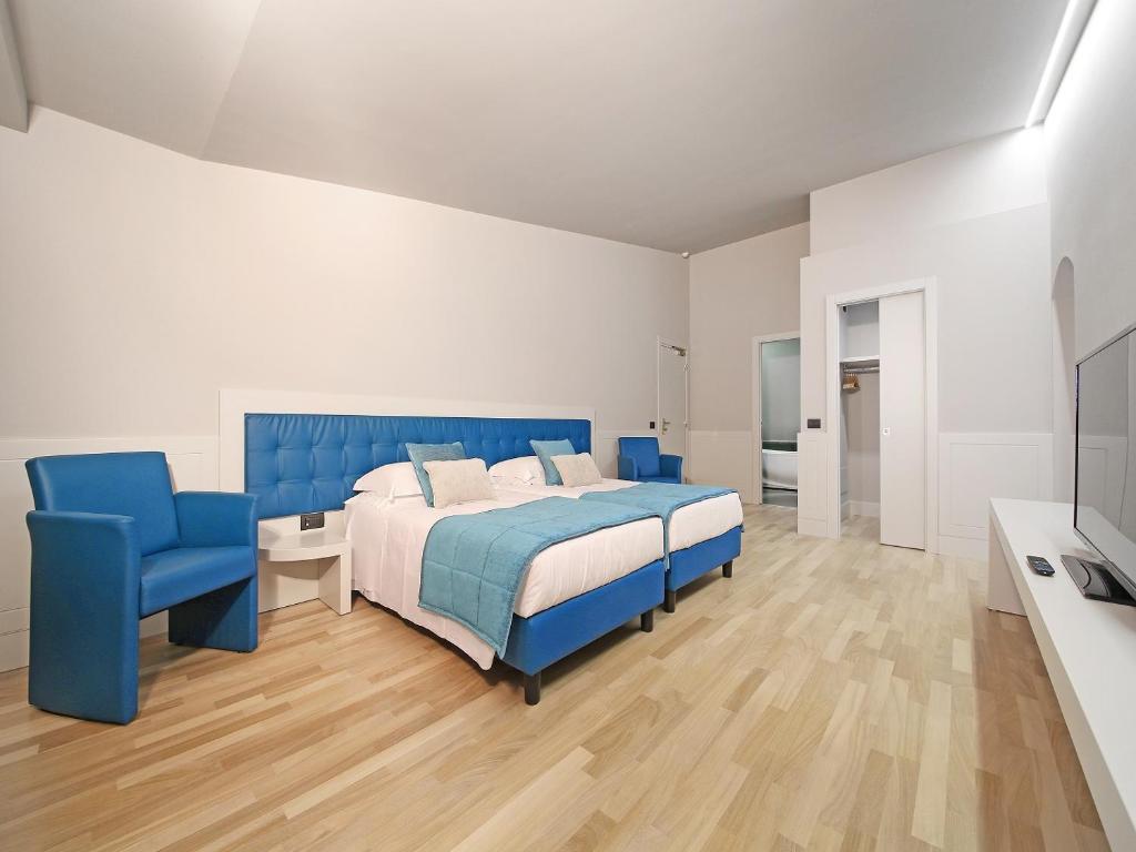 Postel nebo postele na pokoji v ubytování Hotel Salò du Parc