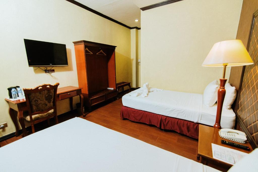 Postel nebo postele na pokoji v ubytování Hotel San Marco