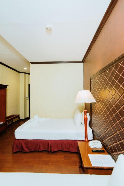 Postel nebo postele na pokoji v ubytování Hotel San Marco