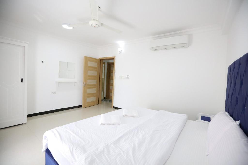 Postel nebo postele na pokoji v ubytování Al Rayyan Hotel Apartments Muscat