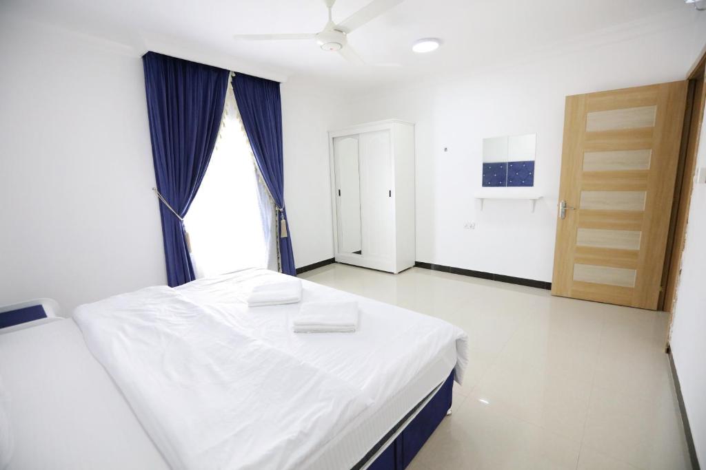 Postel nebo postele na pokoji v ubytování Al Rayyan Hotel Apartments Muscat