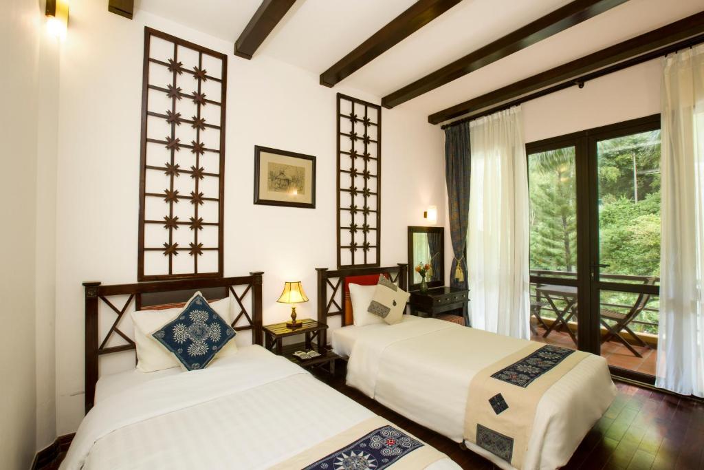 Postel nebo postele na pokoji v ubytování Mai Chau Lodge