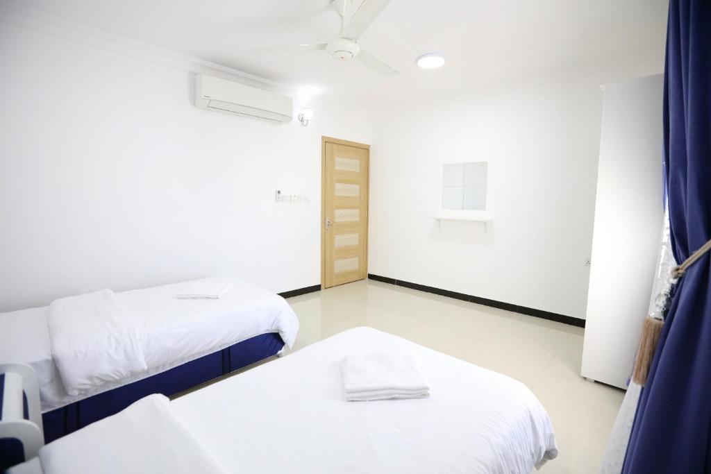 Postel nebo postele na pokoji v ubytování Al Rayyan Hotel Apartments Muscat
