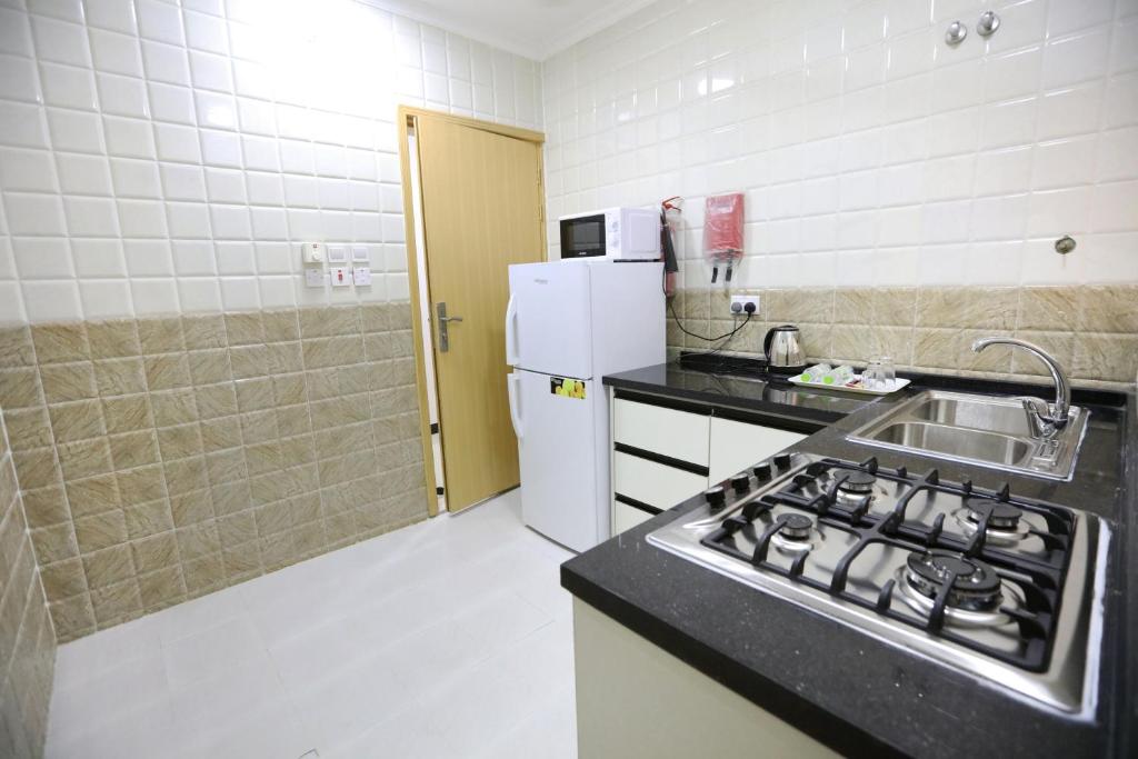Kuchyň nebo kuchyňský kout v ubytování Al Rayyan Hotel Apartments Muscat