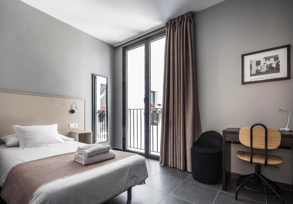Postel nebo postele na pokoji v ubytování Catalina Suites San Nicolas