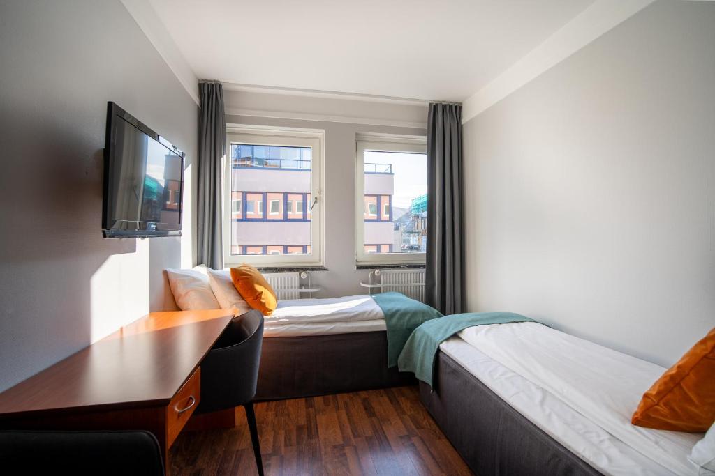 Postel nebo postele na pokoji v ubytování Enter Amalie Hotel
