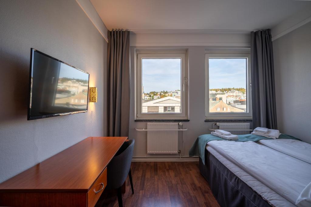 Postel nebo postele na pokoji v ubytování Enter Amalie Hotel