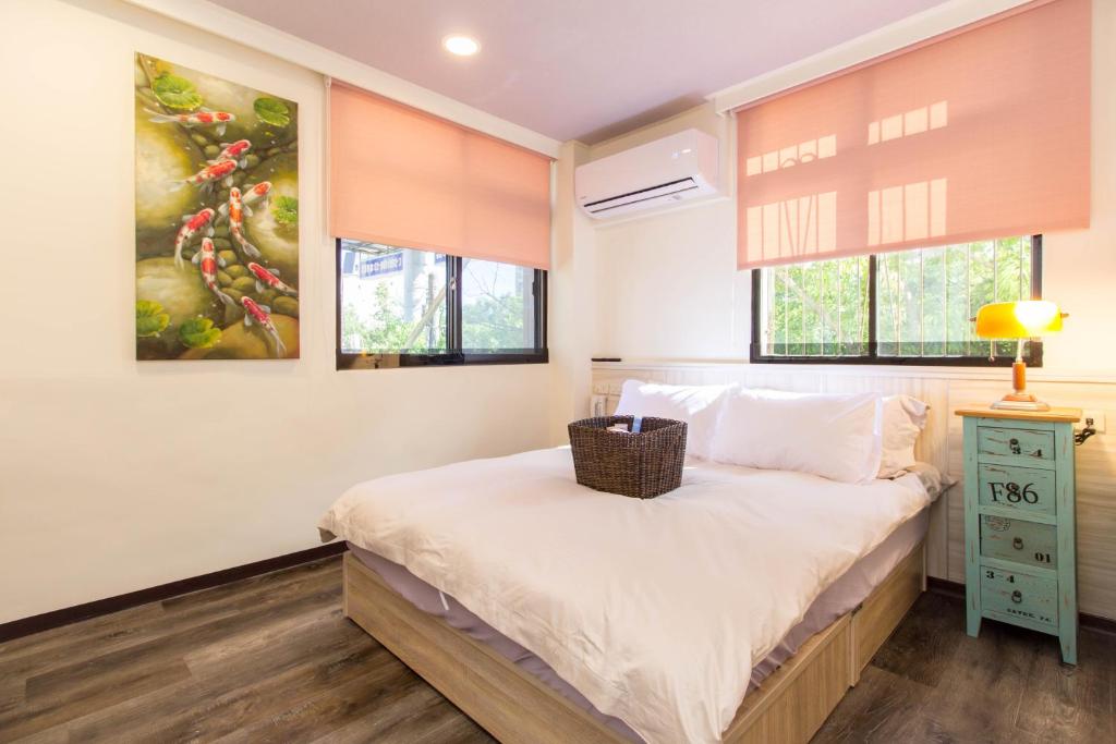 Postel nebo postele na pokoji v ubytování Meizhou Hot Spring Hotel溫泉商旅