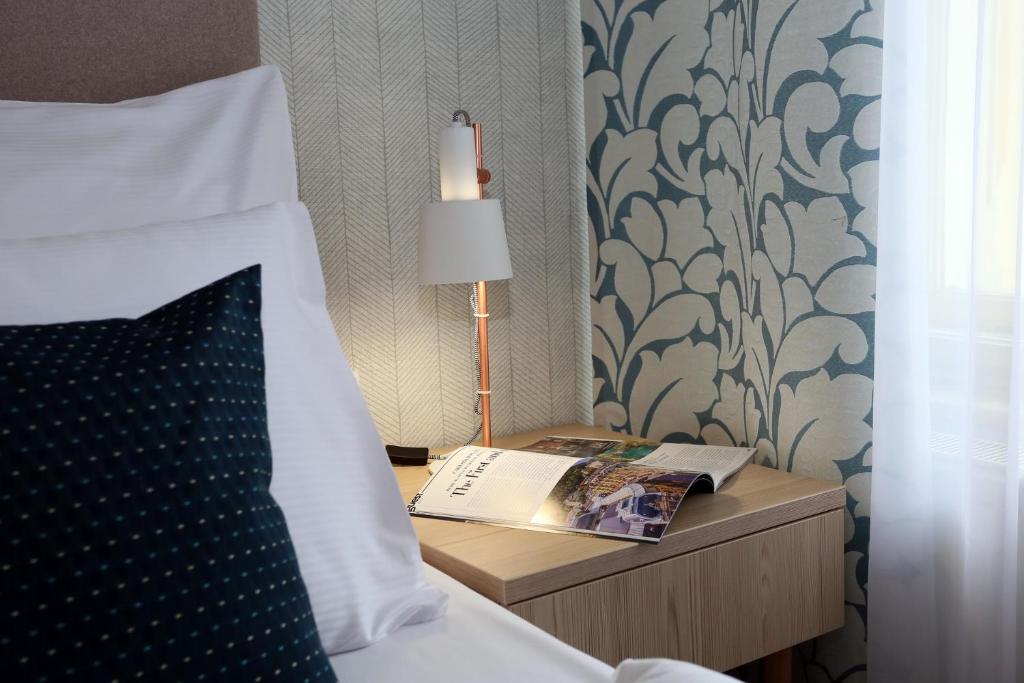 Postel nebo postele na pokoji v ubytování ASTORIA Hotel & Medical Spa