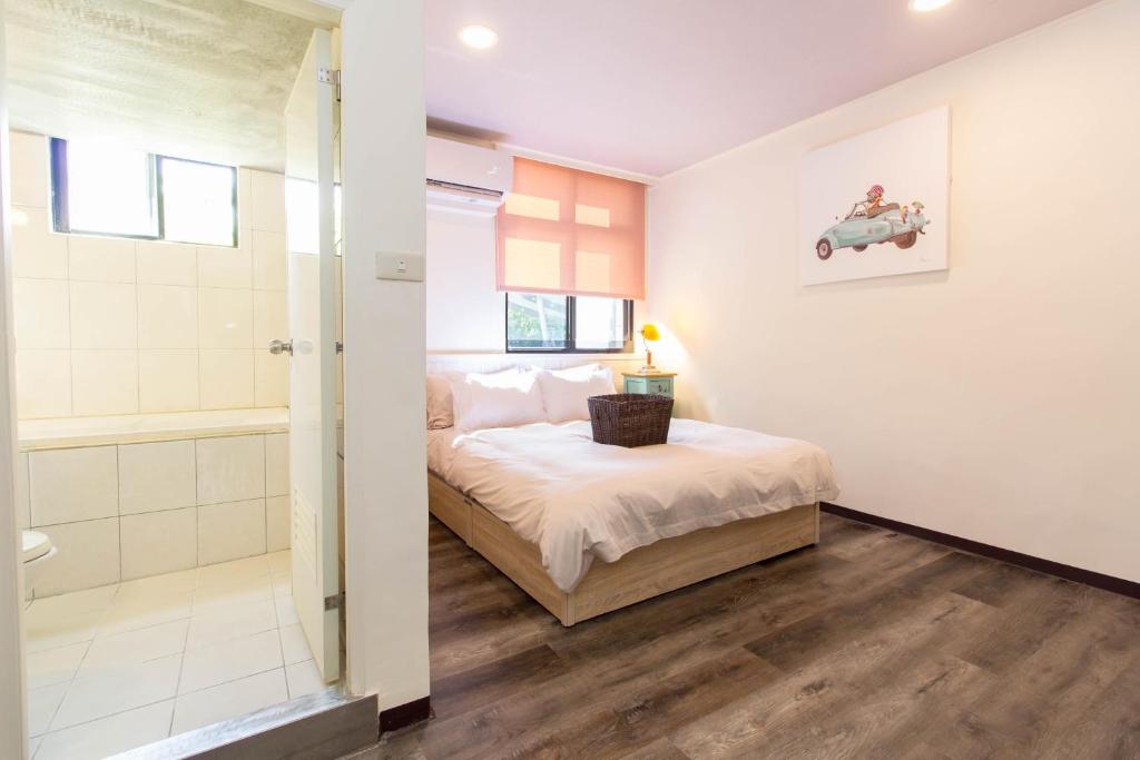 Postel nebo postele na pokoji v ubytování Meizhou Hot Spring Hotel溫泉商旅