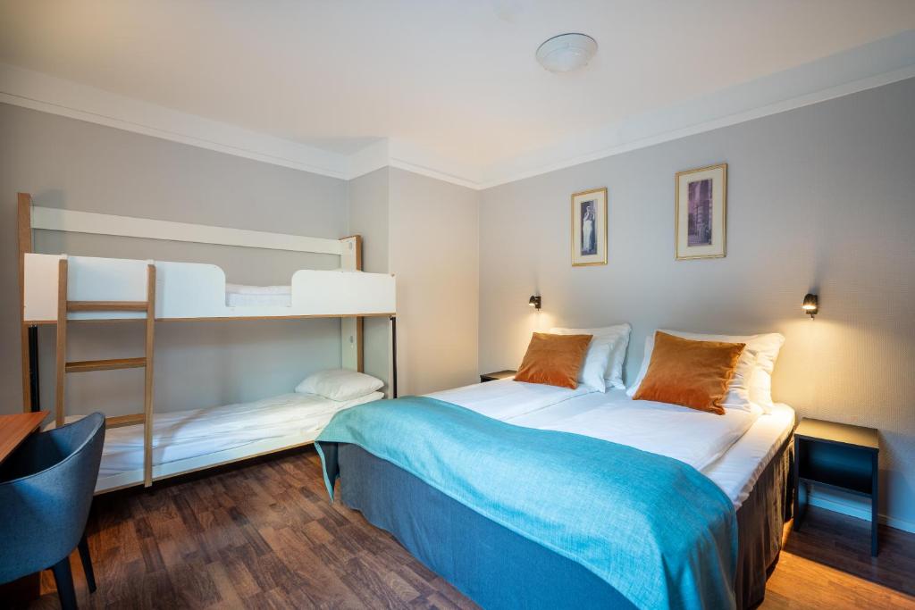 Postel nebo postele na pokoji v ubytování Enter Amalie Hotel